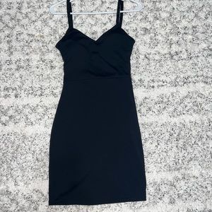 Skin tight black dress with semi open back.